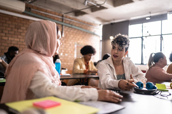 two women at a desk in a co-work room